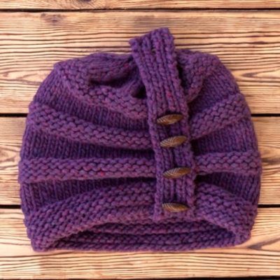 Charlotte Rose Hat flat shot on wood alpaca wool