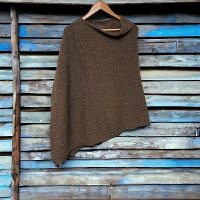 Saddle on blue wood alpaca merino wool